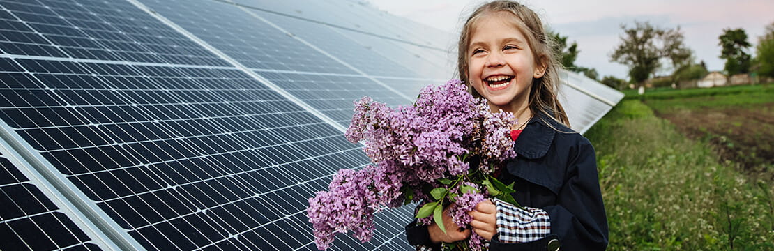 little girl holding flowers